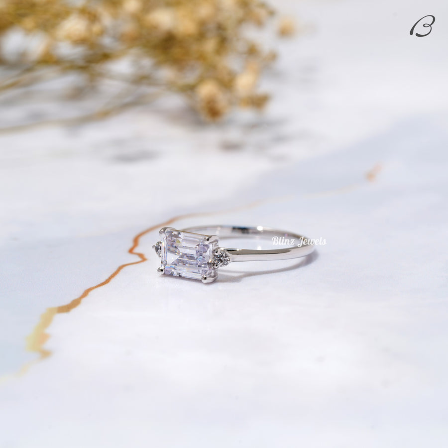 East West Emerald Cut Moissanite Three Stone Engagement Ring